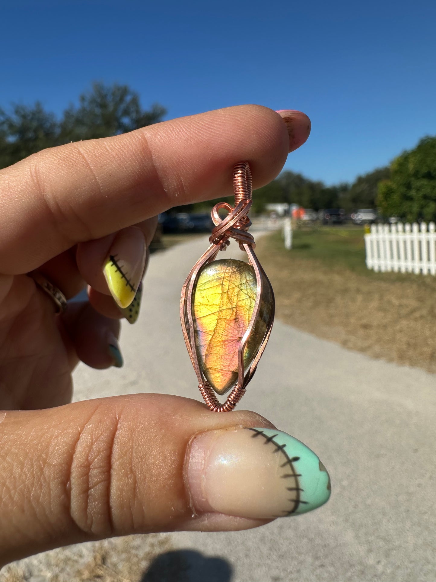 Yellow and purple labradorite copper pendant
