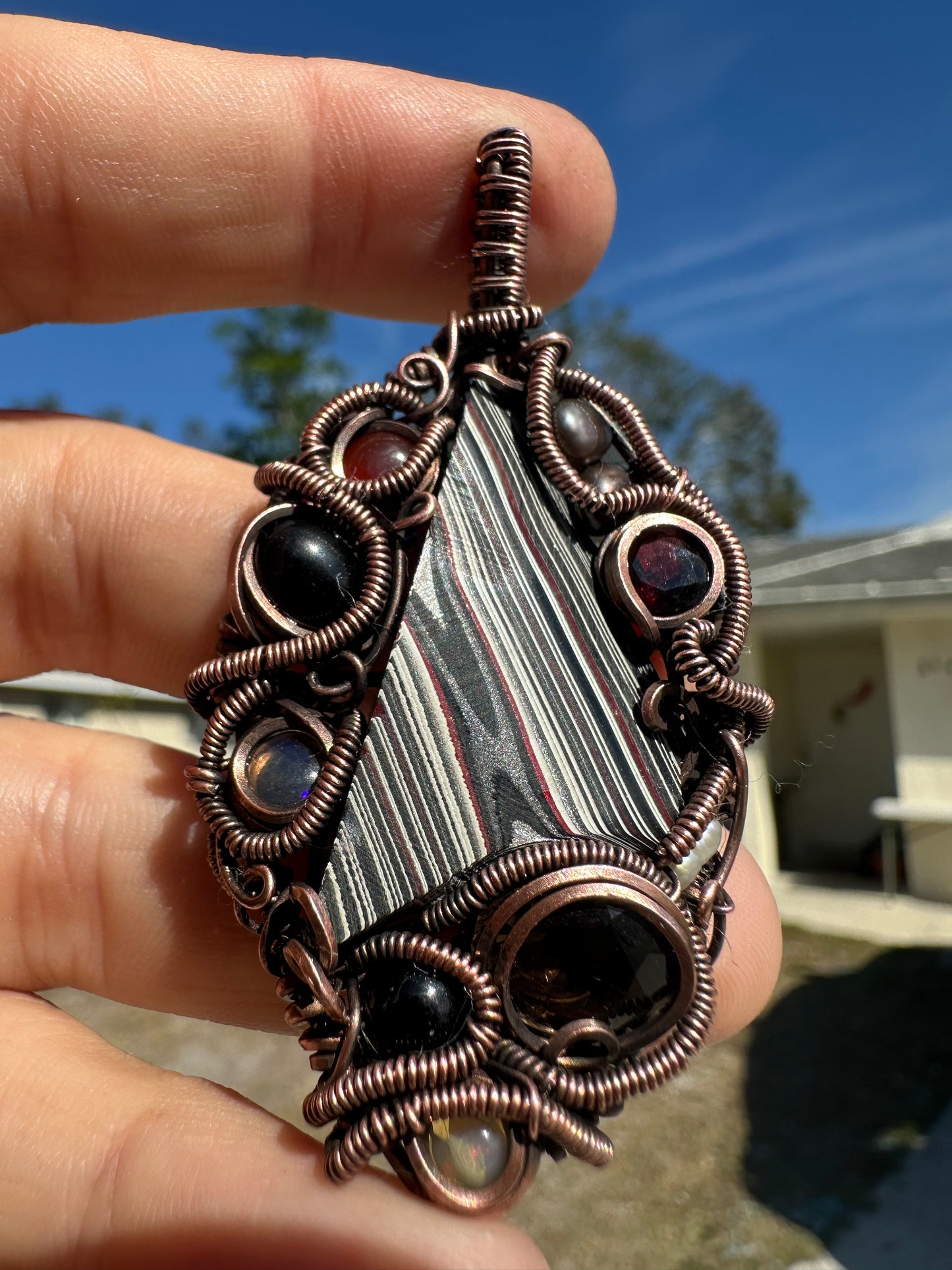 Swirly fordite copper pendant