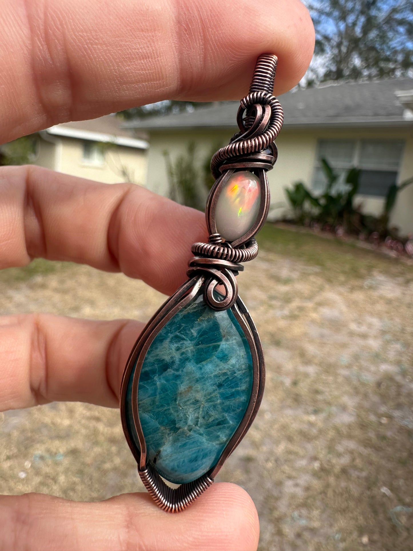 Opal and kyanite copper pendant