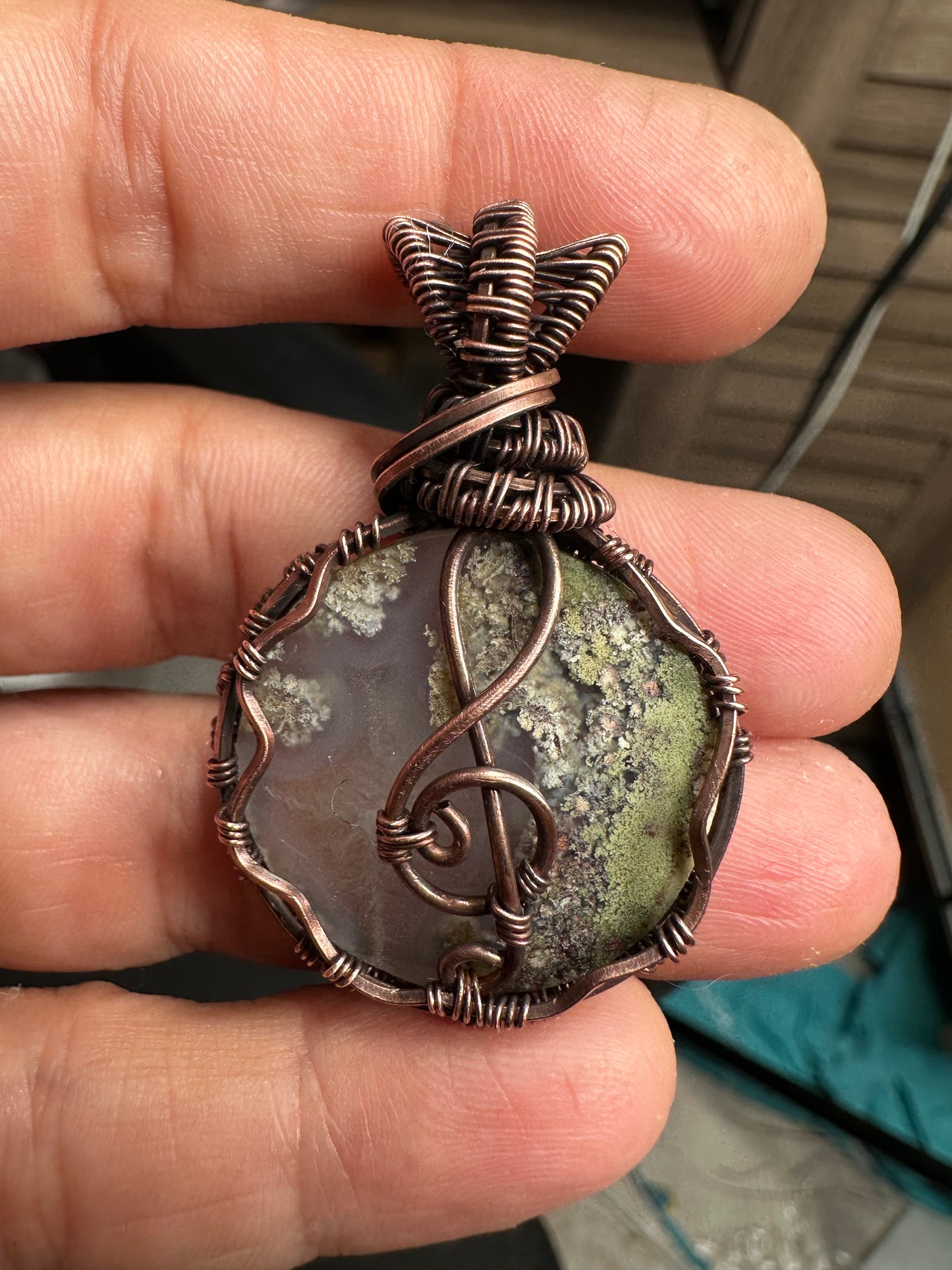 Treble clef moss agate copper pendant