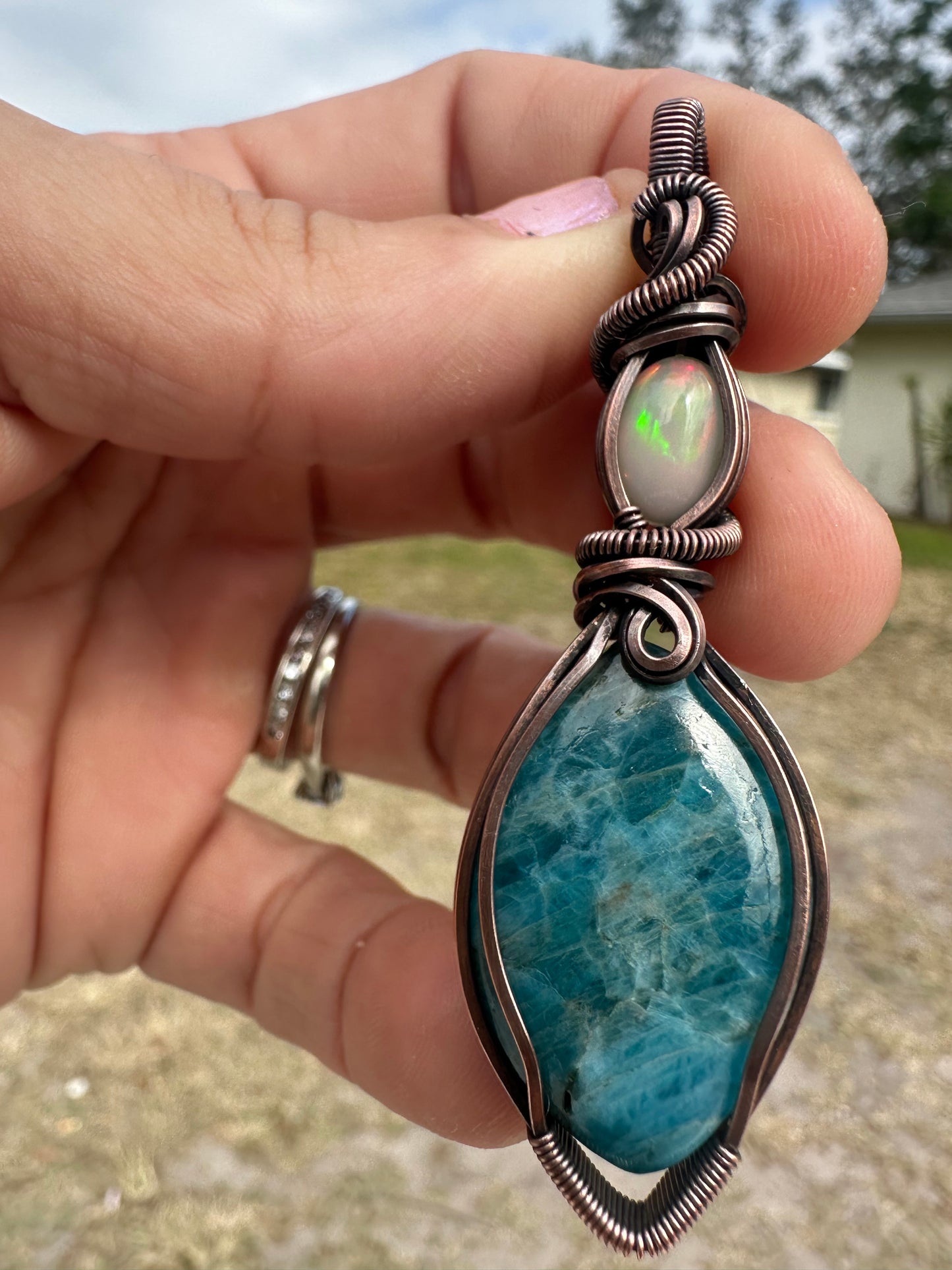 Opal and kyanite copper pendant