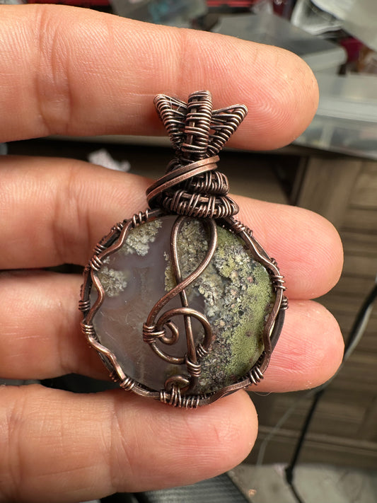 Treble clef moss agate copper pendant