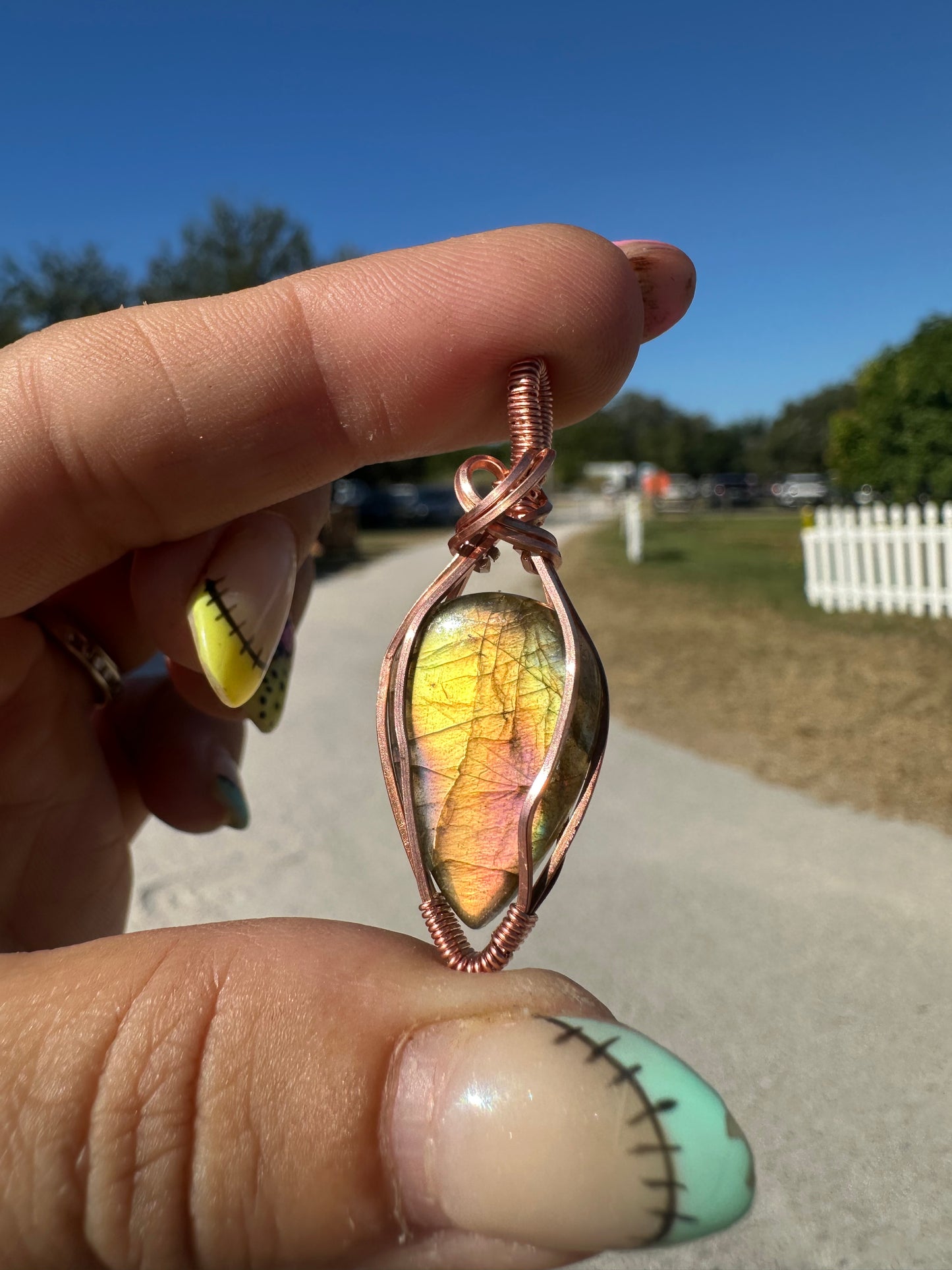 Yellow and purple labradorite copper pendant