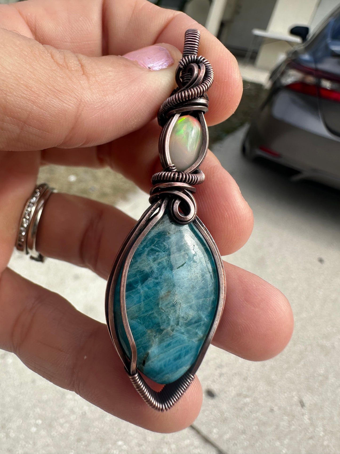 Opal and kyanite copper pendant